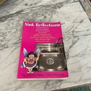 Paperback copy of sink Reflections by The Fly Lady